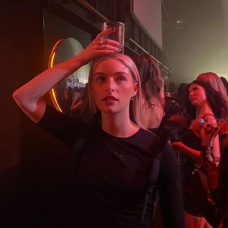 Champagne raised in red club light